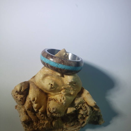 Stabilized maple burl ring with turquoise inlay and steel core.