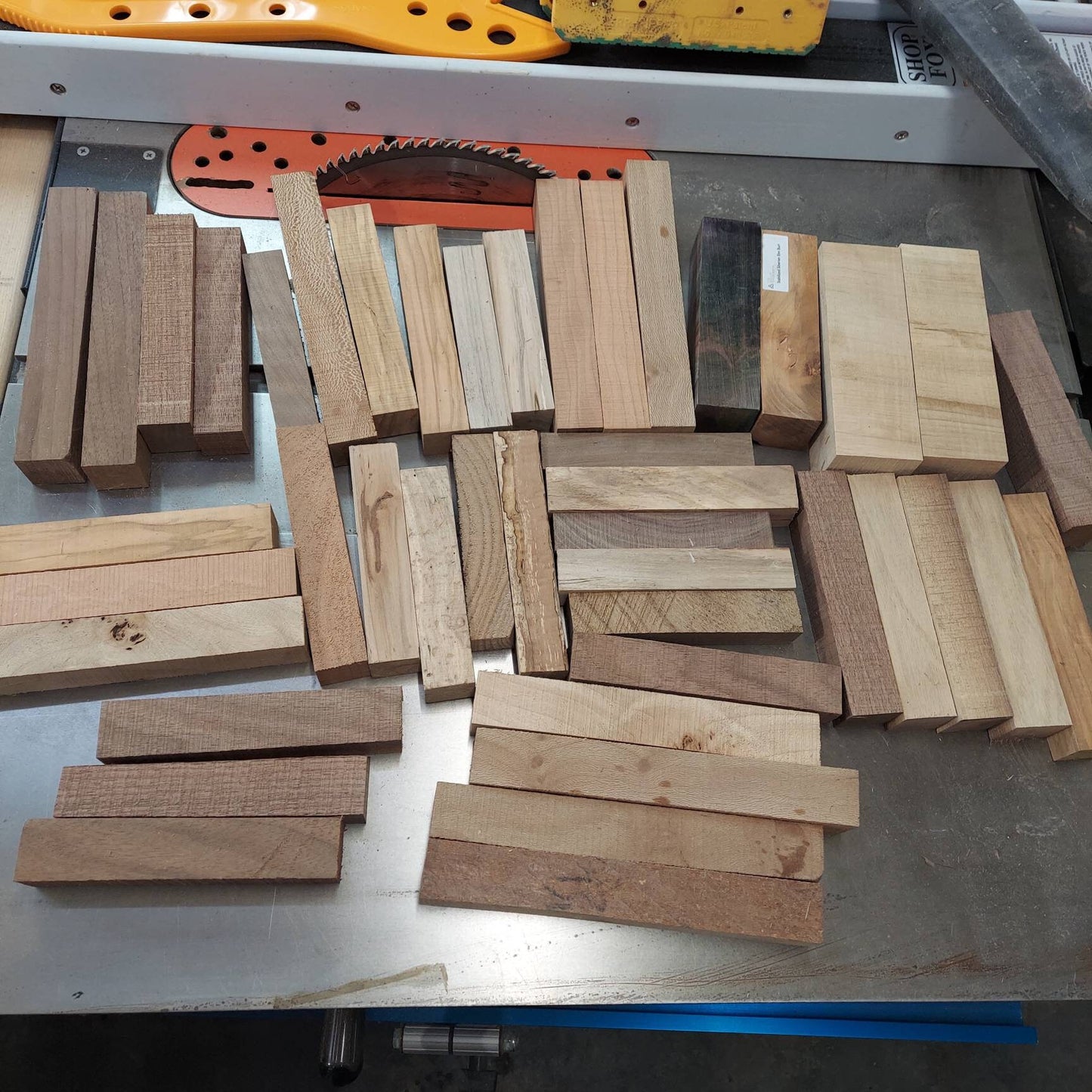 Medium flat rate box of 1"×1"×5" blanks. Mixed species.